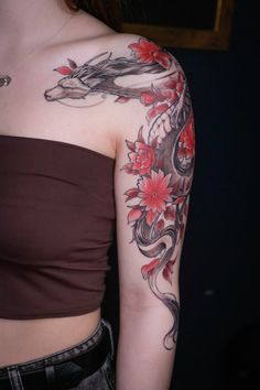 a woman with a dragon tattoo on her arm