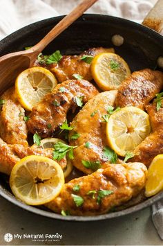 chicken with lemons and parsley in a skillet