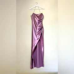 This Stunning Lilac Purple Satin Dress Is Perfect For A Night Out. The Fabric Drapes Beautifully With A Flattering Ruched Detail, While The Elegant Rhinestone-Embellished Halter Adds A Touch Of Sparkle. The Asymmetrical Front Slit Gives The Dress A Sleek, Modern Look, Perfect For Making A Statement On Any Occasion. Dusty Purple Dress, Purple Satin Dress, Dusty Purple, Purple Satin, Rhinestone Dress, Lilac Purple, Draped Fabric, Satin Dress, Purple Dress