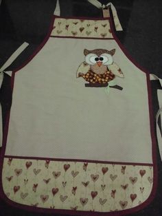 an apron with an owl and hearts on it