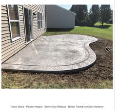 a concrete patio being built in front of a house