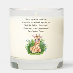 a candle that has a giraffe on it with a poem in the middle