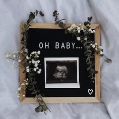 an old photo frame with flowers and baby's breath written on the front in white