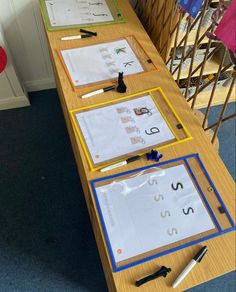 the table is set up with several different types of letters and numbers to practice letter recognition