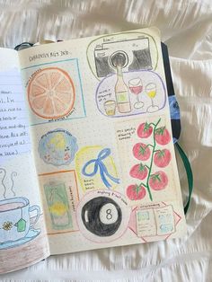 an open notebook with drawings on it