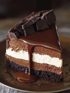 a piece of cake with chocolate and white frosting on a metal platter, ready to be eaten