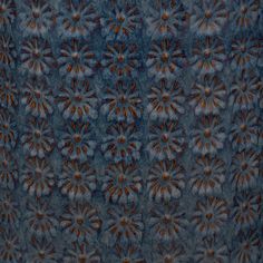 an image of a blue and brown pattern with flowers on it's surface that looks like something out of space