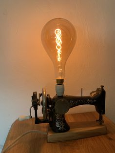 an old sewing machine turned into a light bulb