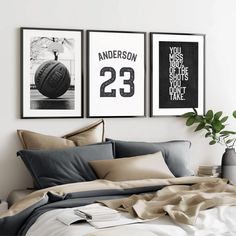 a bedroom with three framed sports posters on the wall