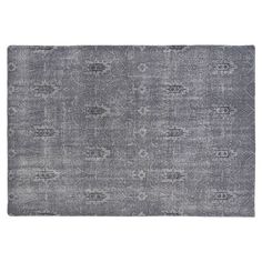 a gray rug with an intricate design on the top and bottom, along with a white background