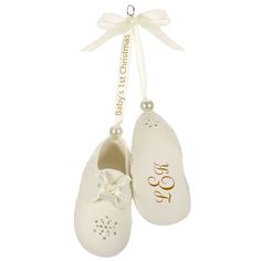 Details You'll always remember your baby's first Christmas. This sweet Christmas tree ornament features a pair of precious porcelain baby booties with a snowflake design and 14k gold accents hanging from a ribbon to commemorate this special time for your family. Personalize with a name, date or short message on one bootie and add the little one's monogram to the other bootie to create a special gift. Choose a font, then customize with a name, date or your own personal message on one bootie, and add a monogram to the other bootie. Additional Details: Artist crafted by Edythe Kegrize. Porcelain Christmas tree ornament with 14k gold accents.  Includes: One personalized Keepsake Ornament in gift box for easy gift giving, preservation and storage. Size Approx.: 1.31 x 2.625 x 1.25 Shoe Ornaments, Porcelain Christmas Ornaments, Christmas Monogram, Baby First Christmas Ornament, Porcelain Ornaments, Christmas Keepsakes, Gifts Baby, Sweet Christmas, Gorgeous Christmas