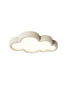 a white cloud shaped light fixture on a white background with no clouds in the sky