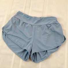 Excellent gently used pre-owned condition with minimal signs of wear and tear as seen in images. Blue High-waisted Athletic Shorts With Pockets, Light Blue Athletic Shorts With Built-in Shorts, Blue Short Skort For Summer, Blue Short Summer Skort, Blue Summer Short Skort, Light Blue Athletic Shorts, Light Blue Shorts, Gym Shorts, Blue Shorts