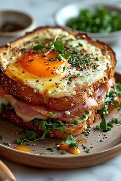 an egg and ham sandwich on toast with parsley sprinkled around the edges