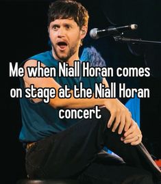 a man sitting in front of a microphone with the words me when nail horan comes on stage at the nail horan concert