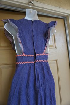 "Vintage 70s hand made denim dress size XS. Very small please see measurements. In great vintage condition. measurements taken across front lying flat N/A armpit to armpit 12\" across empire waist 26\" across hips 54\" length shoulder to bottom" Fitted Denim Blue Cotton Dress, Fitted Denim Blue Bohemian Dress, Retro Summer Cotton Denim Dress, Retro Cotton Denim Dress, Vintage Sleeveless Dark Wash Denim Dress, Retro Cotton Denim Dress In Denim Blue, Sleeveless Dark Wash Vintage Denim Dress, Sleeveless Vintage Denim Dress In Dark Wash, Retro Denim Blue Cotton Dress