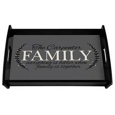 a black tray with the words family and an olive wreath on it, in front of a white background