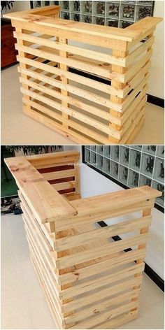 a wooden crate sitting on top of a floor next to a wall with glass windows