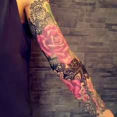 a person with a rose tattoo on their arm