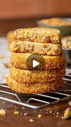 a stack of doughnuts sitting on top of a cooling rack