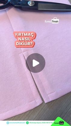 a pair of scissors sitting on top of a pink t - shirt that says, virtma na si dikiir?