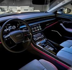 the interior of an audi car is shown at night