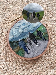 an image of people walking on the road with their backs to each other and two circular mirrors above them