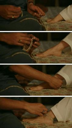 the hands of two people who are tying bracelets to one another's feet