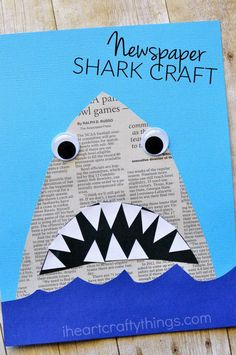 a paper shark craft with the words newspaper shark on it and an image of a shark in