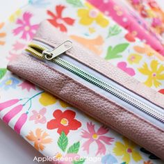 the zippers are closed on top of each other in different colors and patterns,