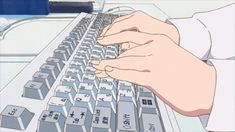 a person is typing on a computer keyboard