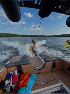 a person on a jet ski being pulled by a boat