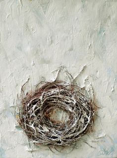 a bird's nest is shown on a white painted wall with brown and black paint