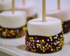 marshmallows with chocolate and sprinkles on them