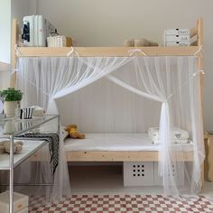 a bedroom with a canopy bed and checkered flooring