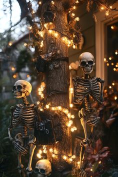 two skeletons are sitting in front of a tree