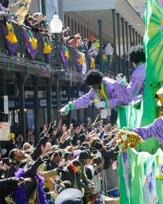 clowns in costumes are performing on the side of a float