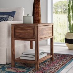 a living room scene with focus on the end table and sofa in the foreground