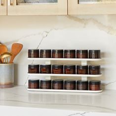 the spice rack is filled with many different types of spices