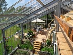 the inside of a greenhouse with lots of plants