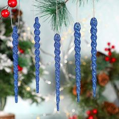 blue glass ornaments hanging from a christmas tree