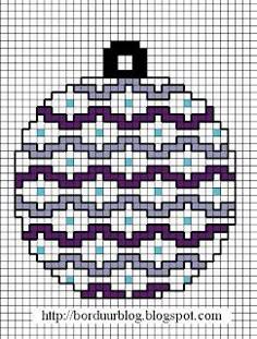 a cross stitch christmas ornament in purple and blue