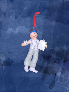 an ornament with a man holding a clipboard