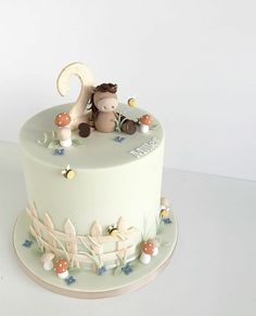 there is a cake that has a teddy bear on it