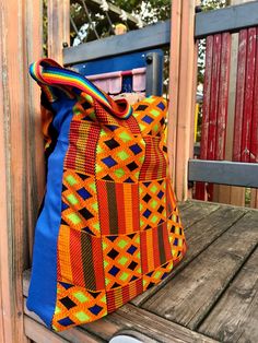 This a unique bag that I made with a vintage African print fabric, bright and colourful. One side is one panel and the other side is patches and glued plastic ceramic pieces ( inspired by the series Lock&Key, Netflix)  It's one of a kind Colorful Retro Tote Bag, Multicolor Patchwork Tote Bag, Multicolor Patchwork Satchel Bag, Vibrant Multicolor Rectangular Bags, Multicolor School Pouch Bag, Multicolor Pouch Bag For School, Retro Multicolor Patchwork Bags, Colorful Patchwork Bags For Daily Use, Colorful Patchwork Rectangular Bag