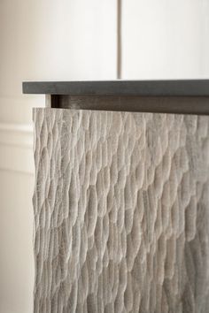 a close up view of the top of a wooden table with wavy patterns on it