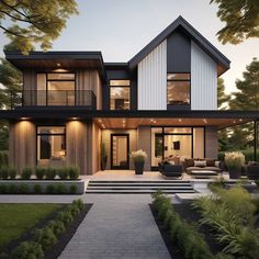 a large modern house with lots of windows and furniture in the front yard at dusk