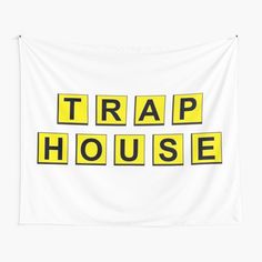 the words trap house in yellow and black on a white background tapestry wall hanging decoration