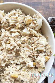 a white bowl filled with food on top of a table