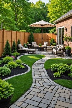 an outdoor patio with landscaping and lawn furniture